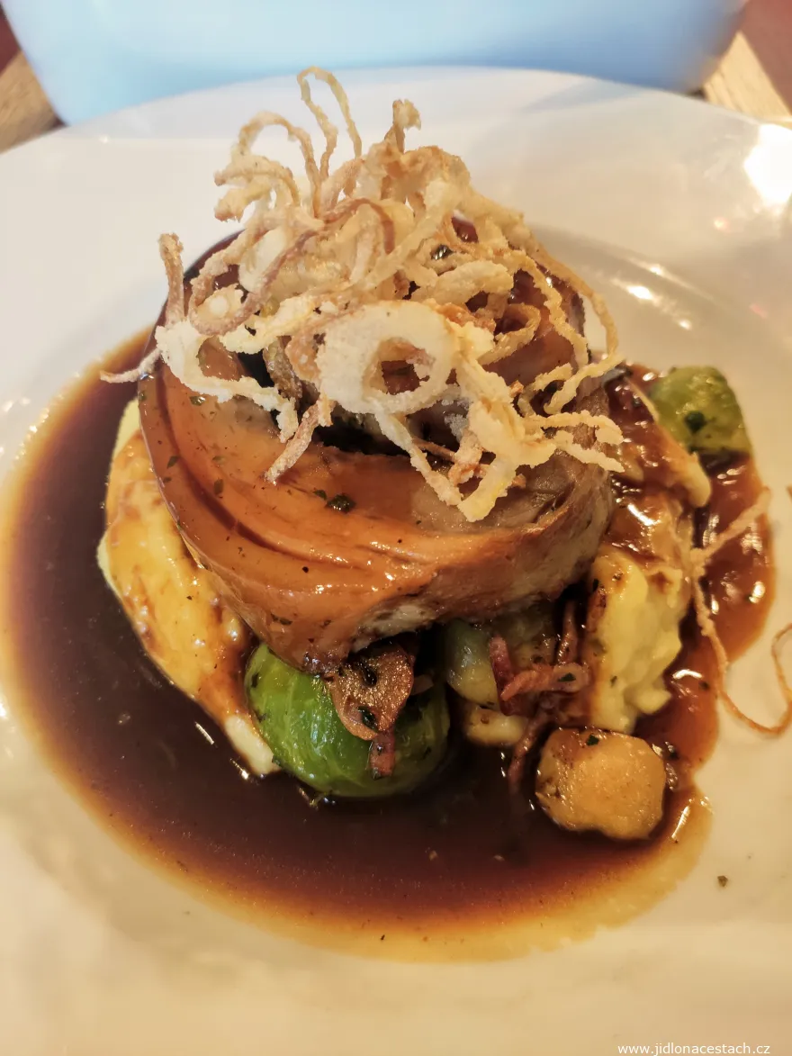 Piglet belly with Viennese onion, black beer sauce, potato purée with foie gras and Brussels sprouts