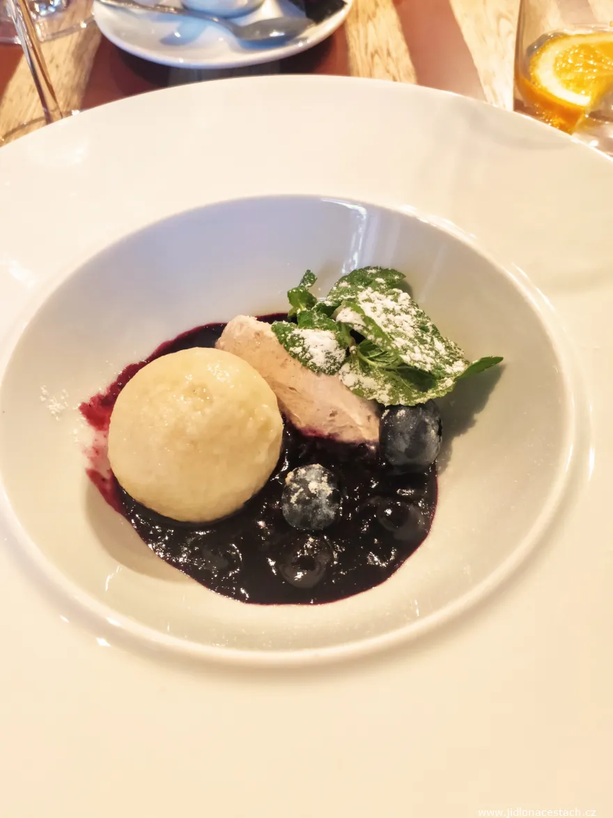 Curd dumplings with nougat, hot blueberries and cinnamon mascarpone