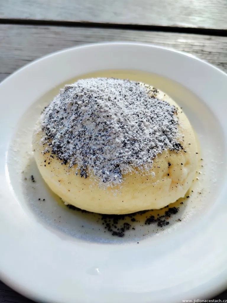 Plum leavened dumpling with curd, poppy seeds, sugar and butter Plum leavened dumpling with curd, poppy seeds, sugar and butter