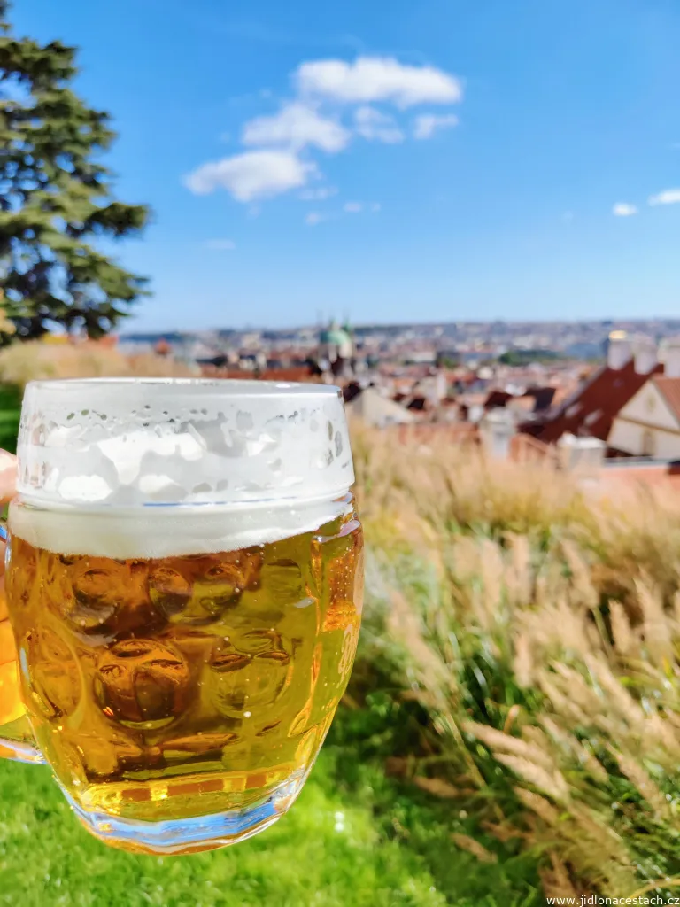 Draft Pilsner and a beautiful view of the hundred-spired Prague Draft Pilsner and a beautiful view of the hundred-spired Prague