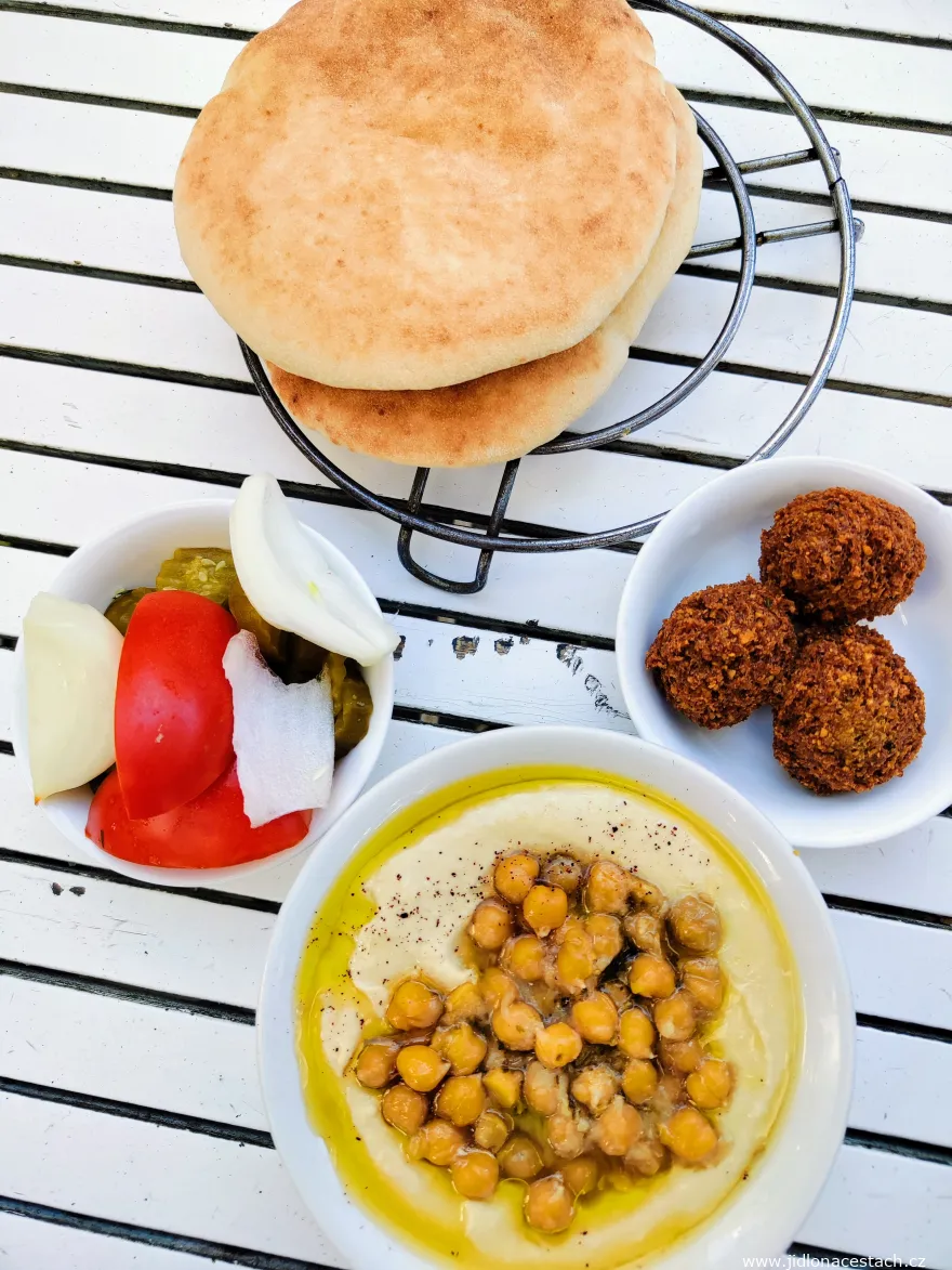 Hummus, falafel, vegetables, and pita bread