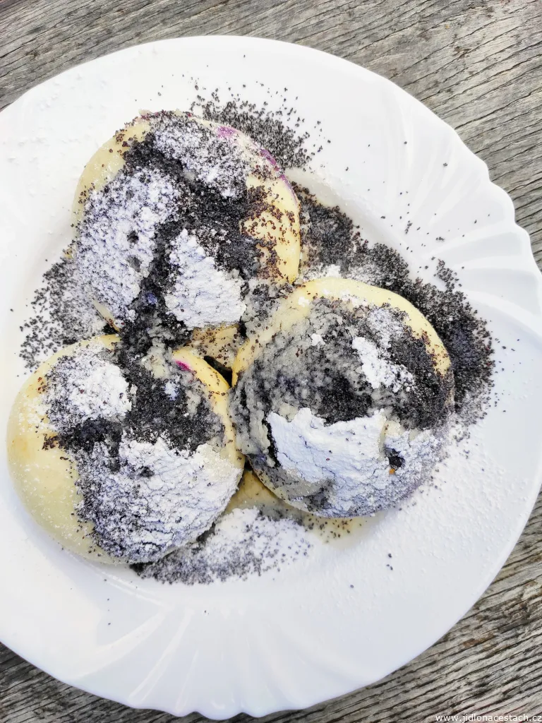 Leavened dumplings filled with blueberries with poppy seeds, sugar and butter Leavened dumplings filled with blueberries with poppy seeds, sugar and butter