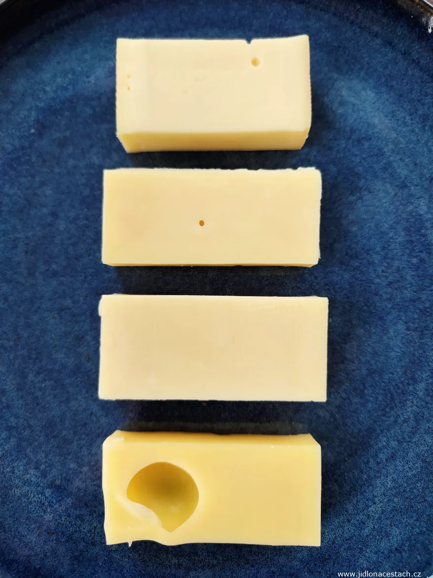 Swiss cheeses Tilsiter, Appenzeller, Gruyère, and Emmental on one plate. Swiss cheeses Tilsiter, Appenzeller, Gruyère, and Emmental on one plate.