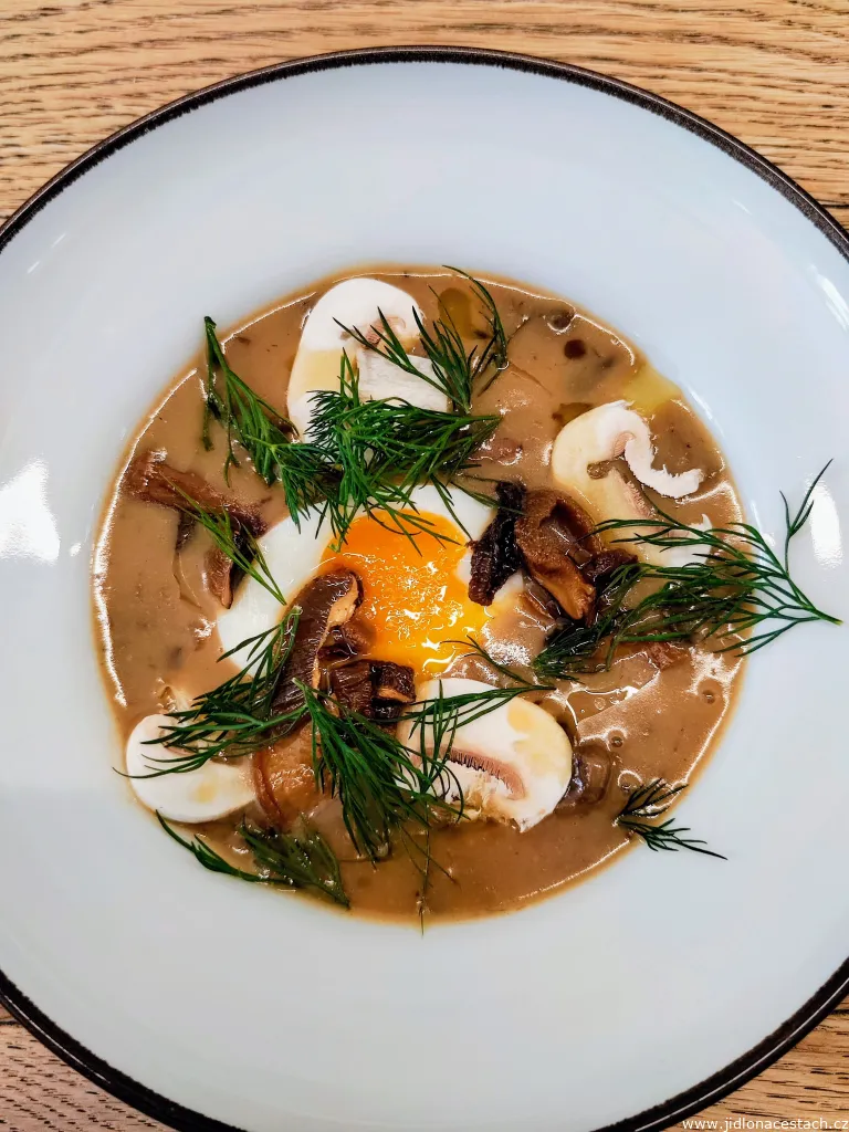 Kulajda with forest mushrooms and an egg