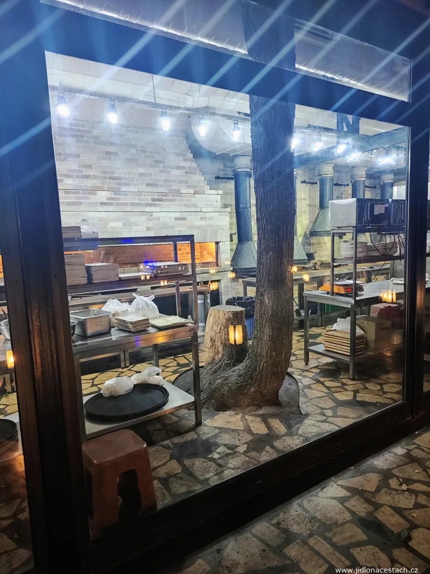 Kitchen of Tavern Yerevan Riverside built around a growing tree
