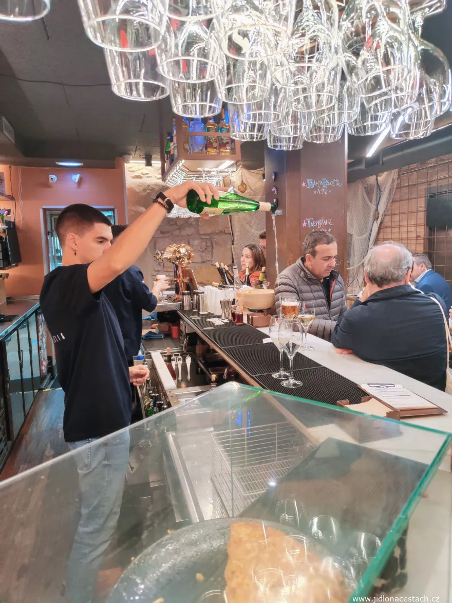 Traditional Basque wine txakoli: pouring from a height in a restaurant in San Sebastián. Traditional Basque wine txakoli: pouring from a height in a restaurant in San Sebastián.