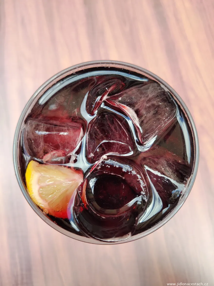 Basque kalimotxo: red wine with cola and a slice of lemon.