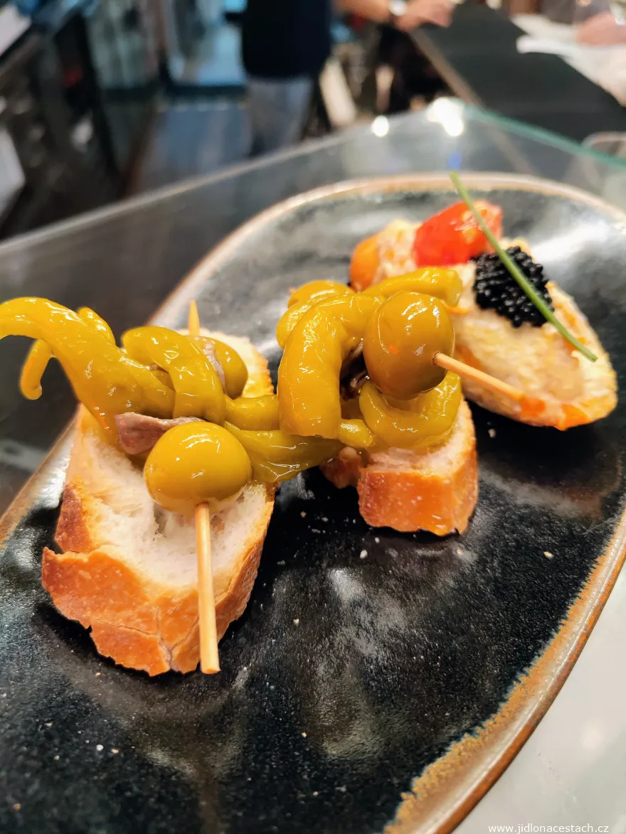 Pintxos Gilda on a slice of baguette in another restaurant in San Sebastián. Pintxos Gilda on a slice of baguette in another restaurant in San Sebastián.