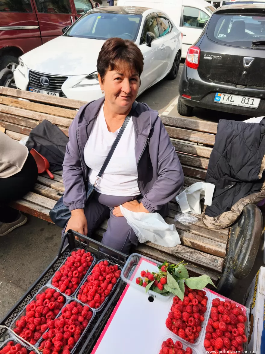 Piața Centrală: a raspberry seller on a bench in front of the market. Piața Centrală: a raspberry seller on a bench in front of the market.