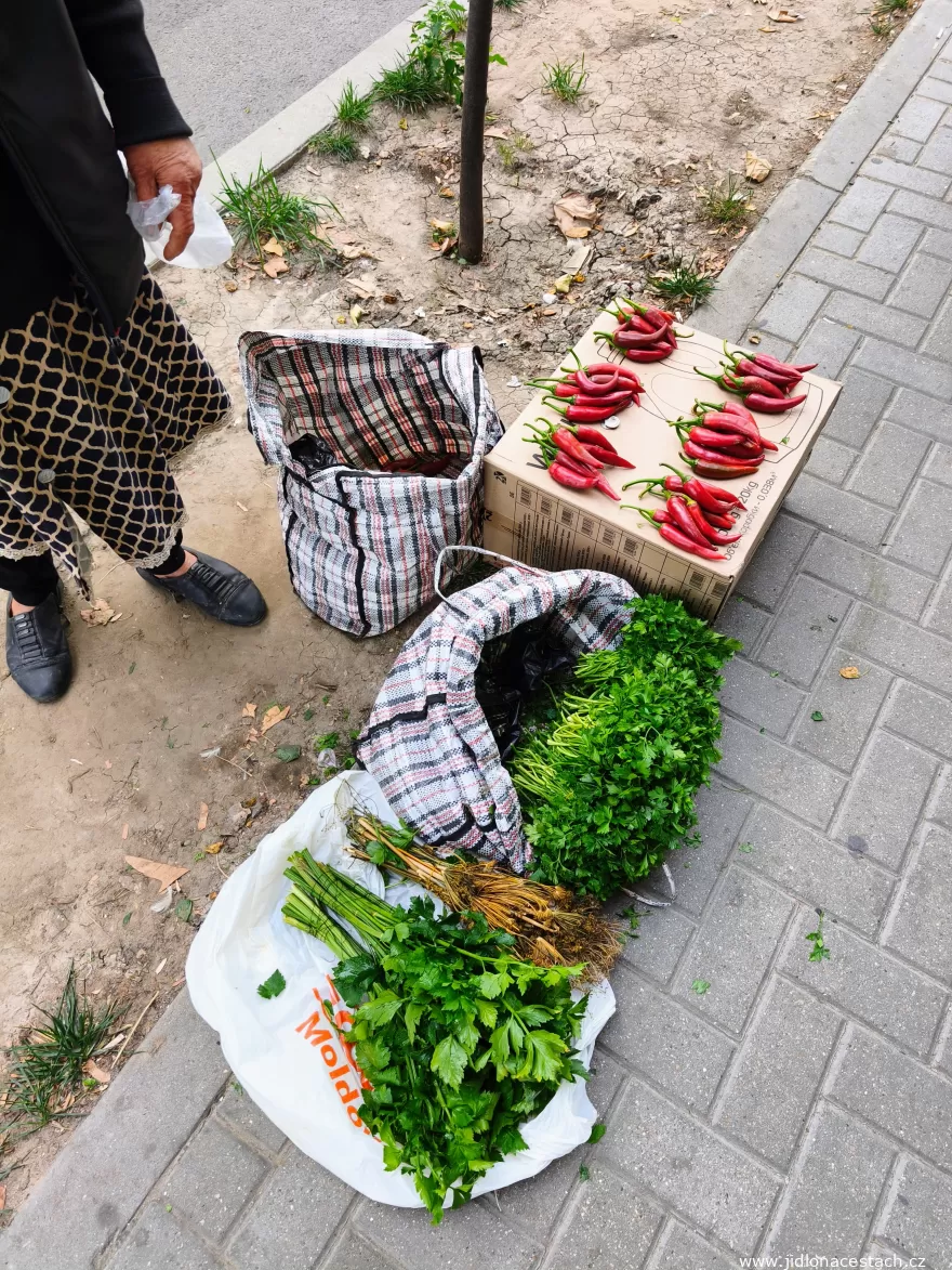 Piața Centrală: hot peppers and greens laid out right on the sidewalk. Piața Centrală: hot peppers and greens laid out right on the sidewalk.