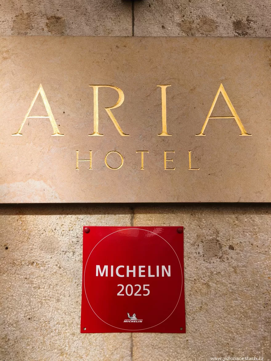 Coda: the entrance to the Aria Hotel with its MICHELIN 2025 plaque.