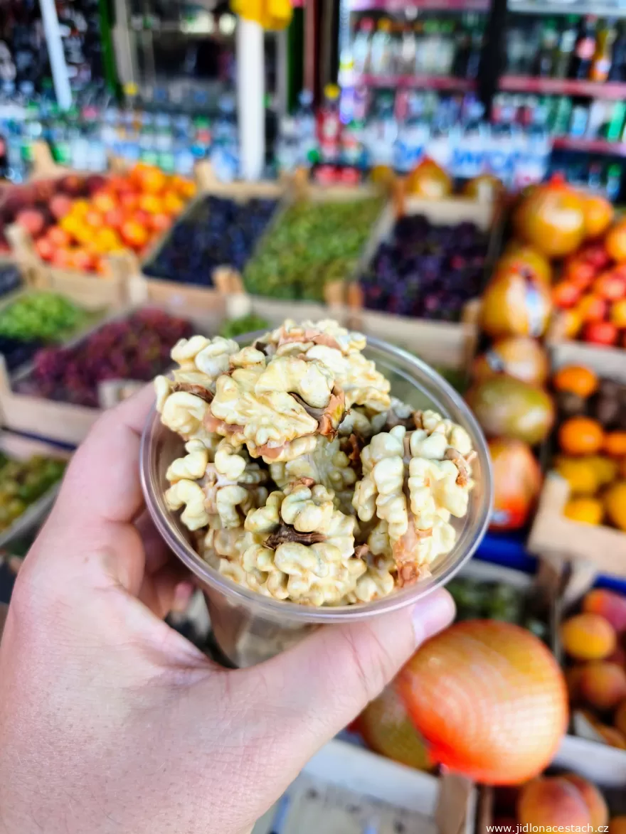Walnuts: shelled kernels in a cup. Walnuts: shelled kernels in a cup.