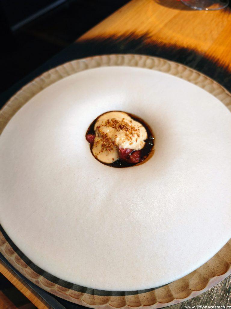 Field Restaurant: fire-grilled duck hearts with tamari glaze, caramelized onion, black garlic crumble, and verbena espuma.