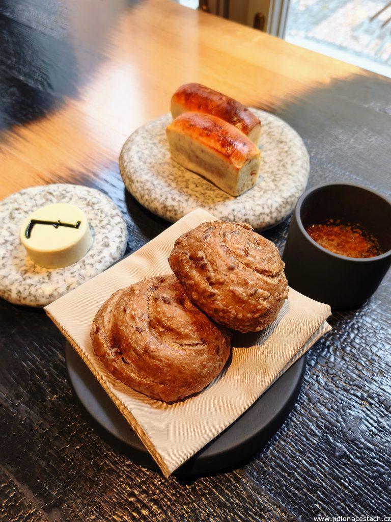 Field Restaurant: butter onion brioche and whole-grain roll with roasted seeds, roasted yeast butter with spruce oil, cottage cheese with buttermilk, chimichurri and poppy seed oil.