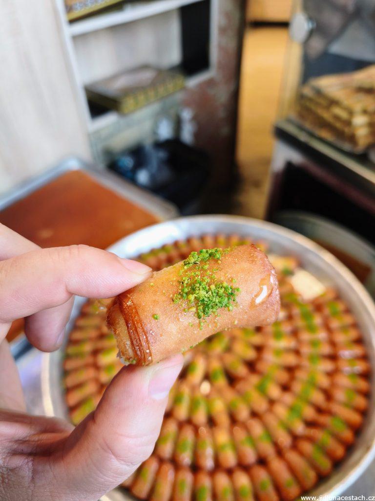 Iraqi national dessert: znoud el sit (sweet roll filled with cream).